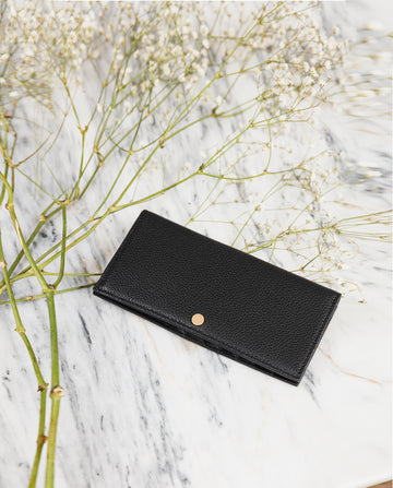 Adonis: A slim, long black leather designer wallet